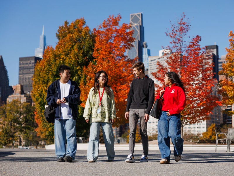 Four students walking on Cornell Tech campus