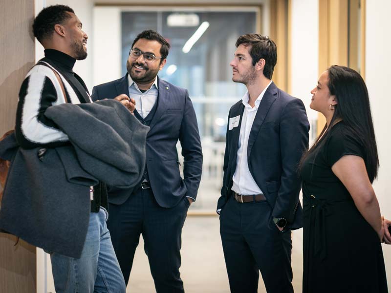 students talking at real estate event