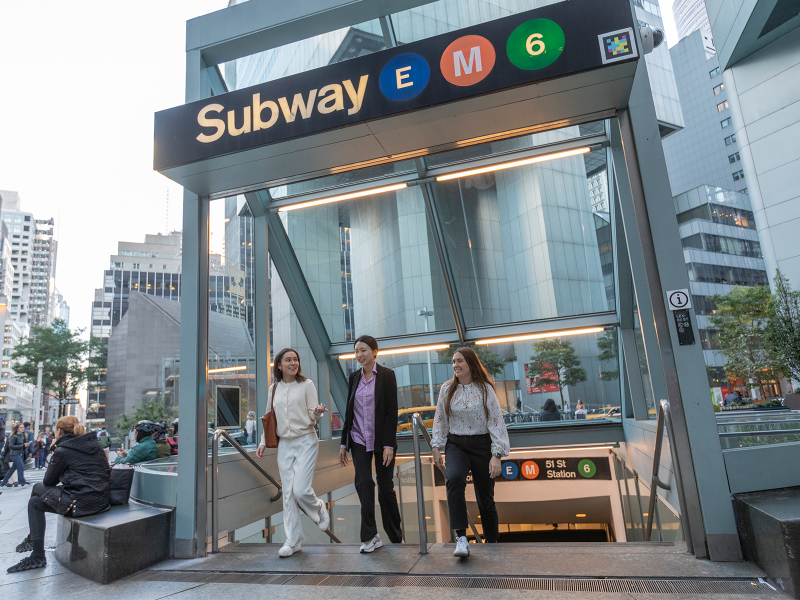 Cornell real estate students in NYC exiting the subway station and walking onto the city streets