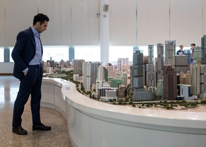 A student viewing a three-dimensional city model.